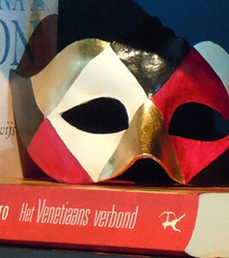 typical mask from venice with red gold and black pattern 