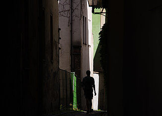 Person in a dark alley